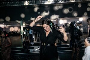 Guest dancing among bubbles at a silent disco