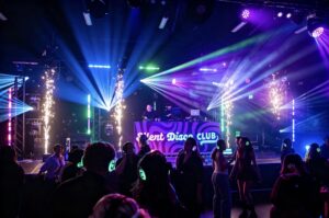 Stage with sparklers and lasers over the silent disco crowd